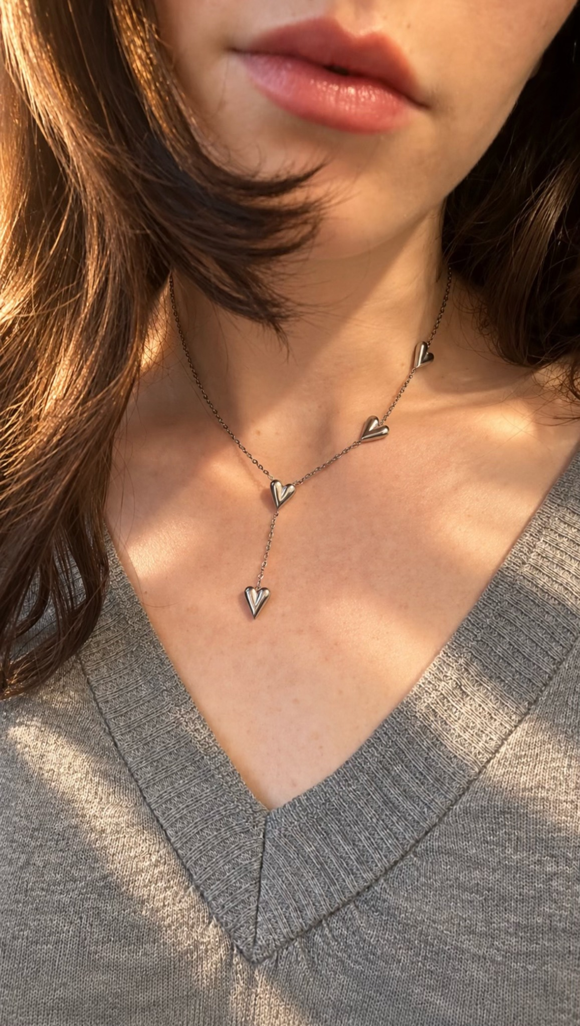 Amoria Necklace silver heart charms worn