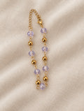 Belissa Bracelet gold lilac bead bracelet on linen