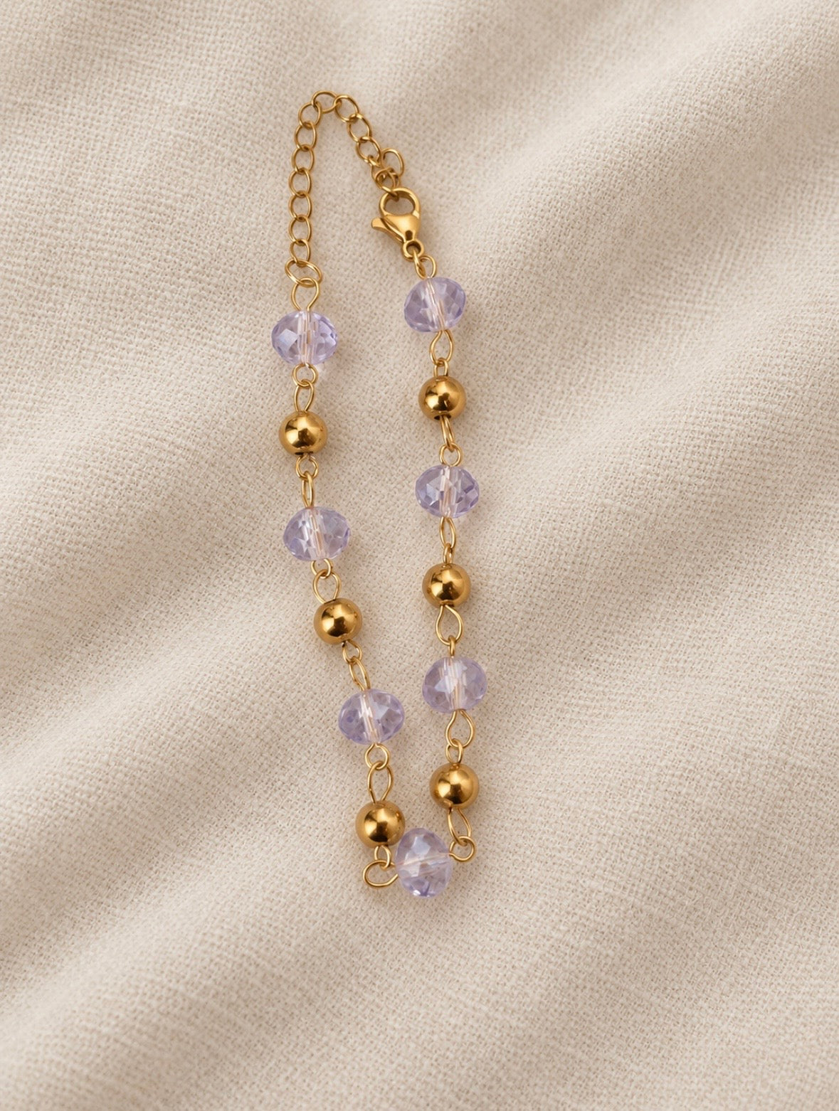 Belissa Bracelet gold lilac bead bracelet on linen