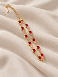 Bellarosa Bracelet gold tone chain with red stones