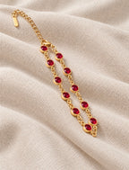 Bellarosa Bracelet gold tone chain with red stones