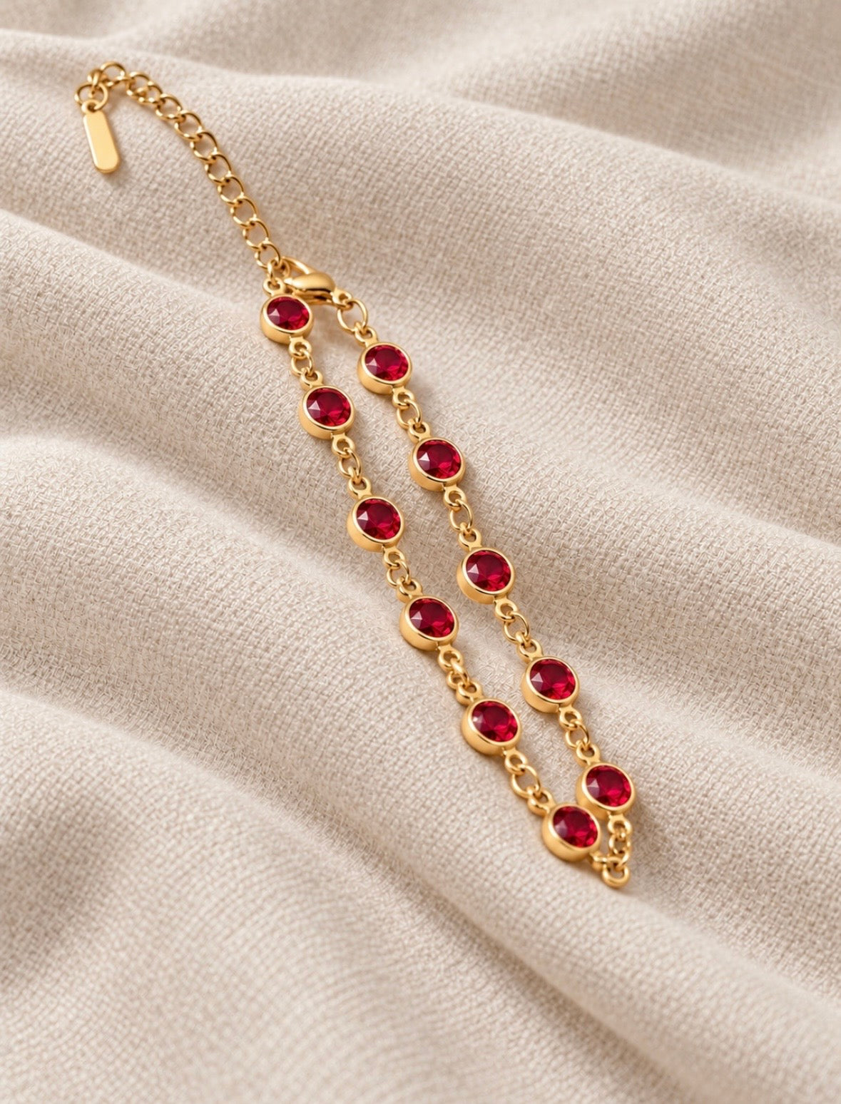 Bellarosa Bracelet gold tone chain with red stones