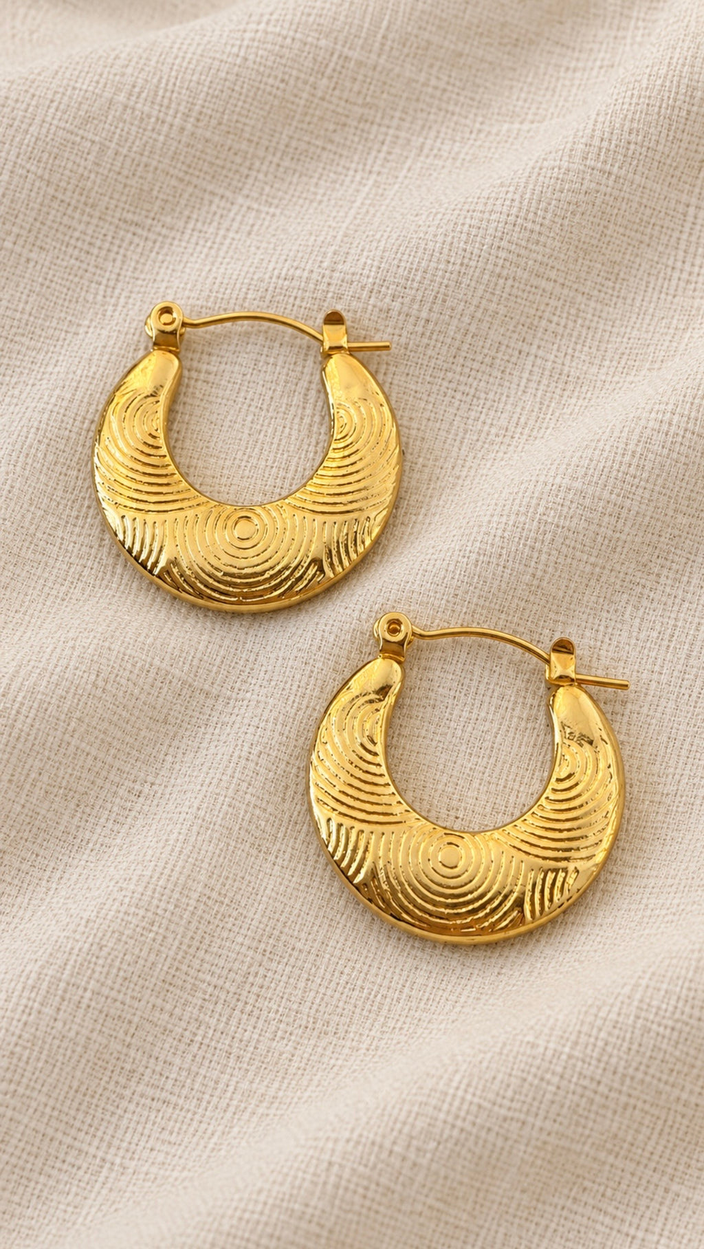 Ciria Earrings – gold textured hoops with engraved circular pattern