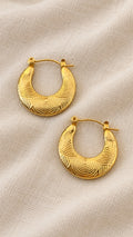 Ciria Earrings – gold textured hoops with engraved circular pattern