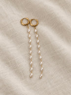 Soreina gold hoop earrings with long pearl-look bead strands