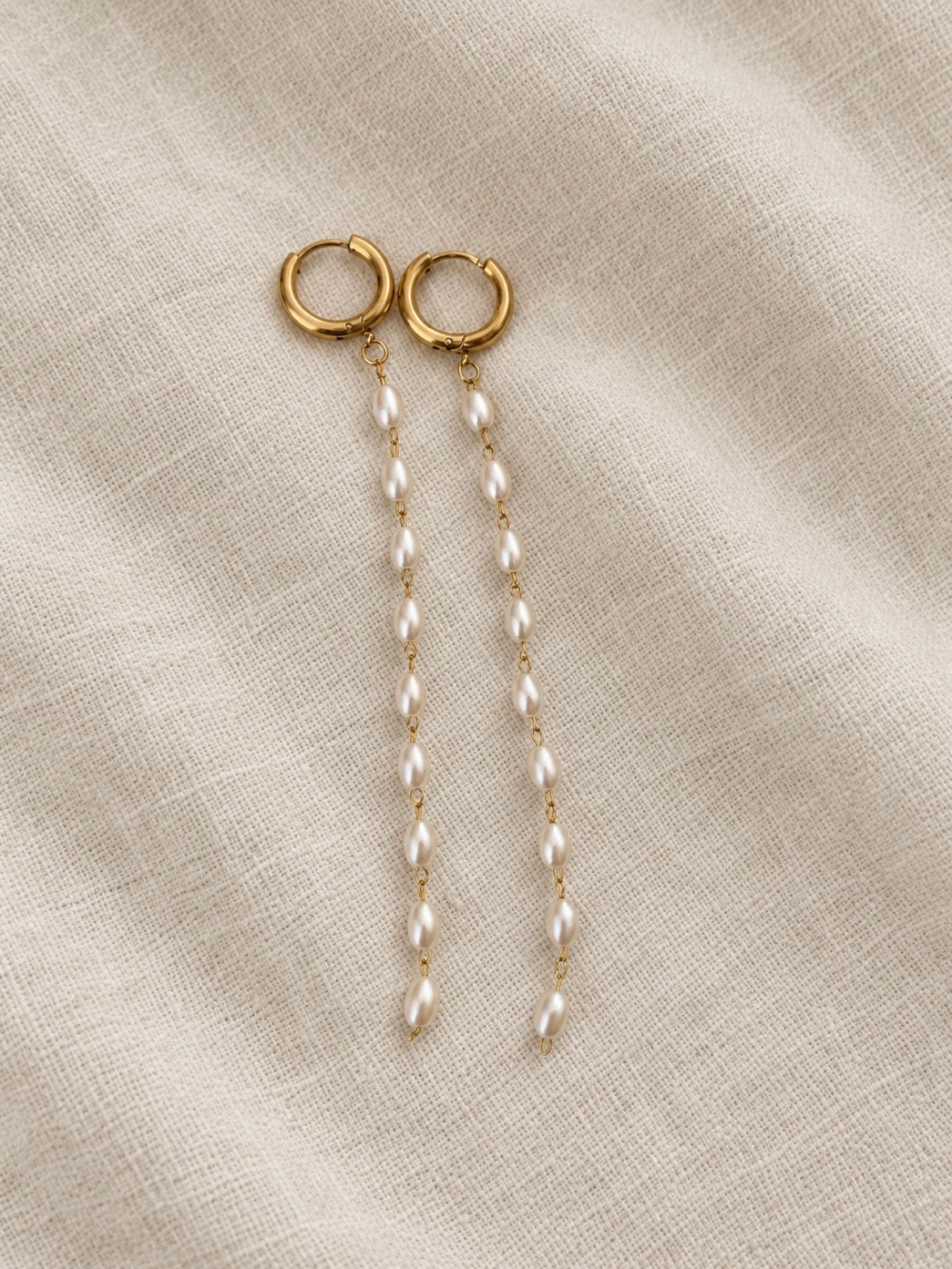 Soreina gold hoop earrings with long pearl-look bead strands